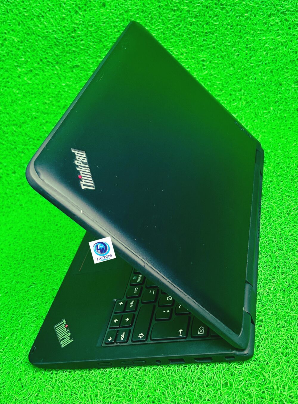 Lenovo Yoga 11e partially closed laptop with logo visible