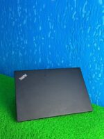 Lenovo X1 Carbon Showing its Top Surface and Logo, Highlighting its Sleek Design