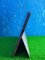 Tablet side look with blue wall