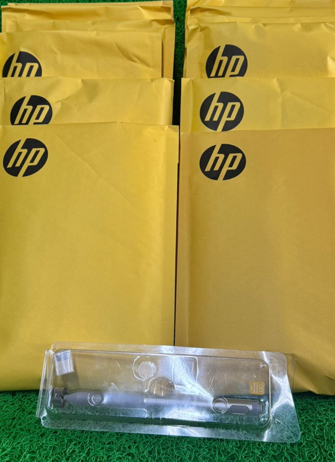 HP-branded yellow envelopes with stylus tray
